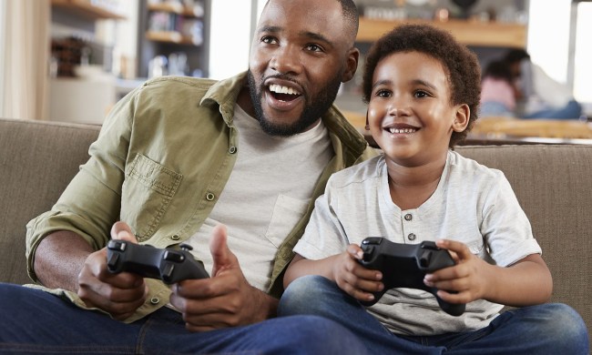 father and son playing video games